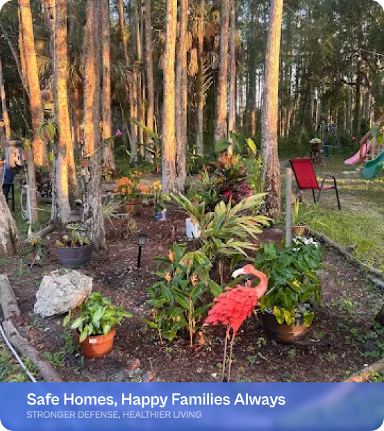 Lush backyard garden with trees and a pink flamingo, promoting safe home living.