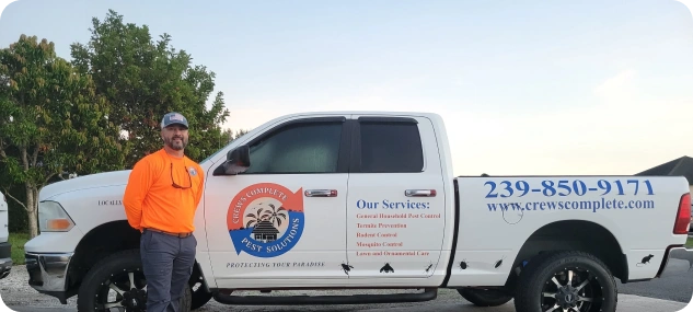Crews Complete Pest Solutions technician and branded service truck ready for a job.