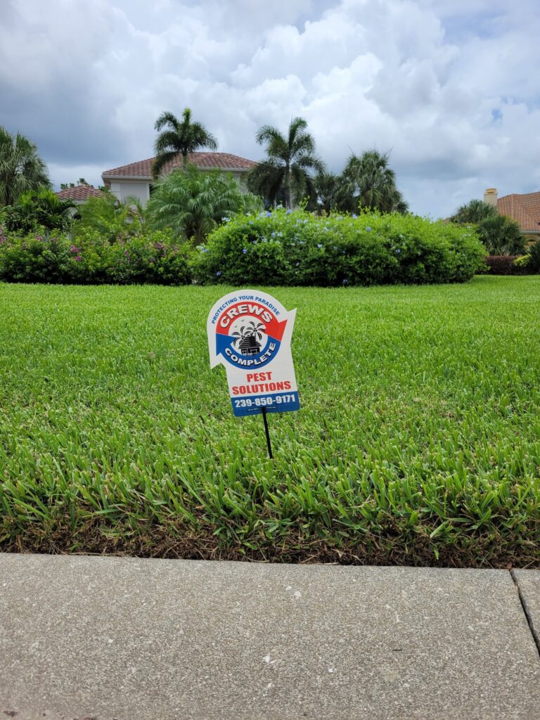 beautiful green healthy lawn with crews complete service sign