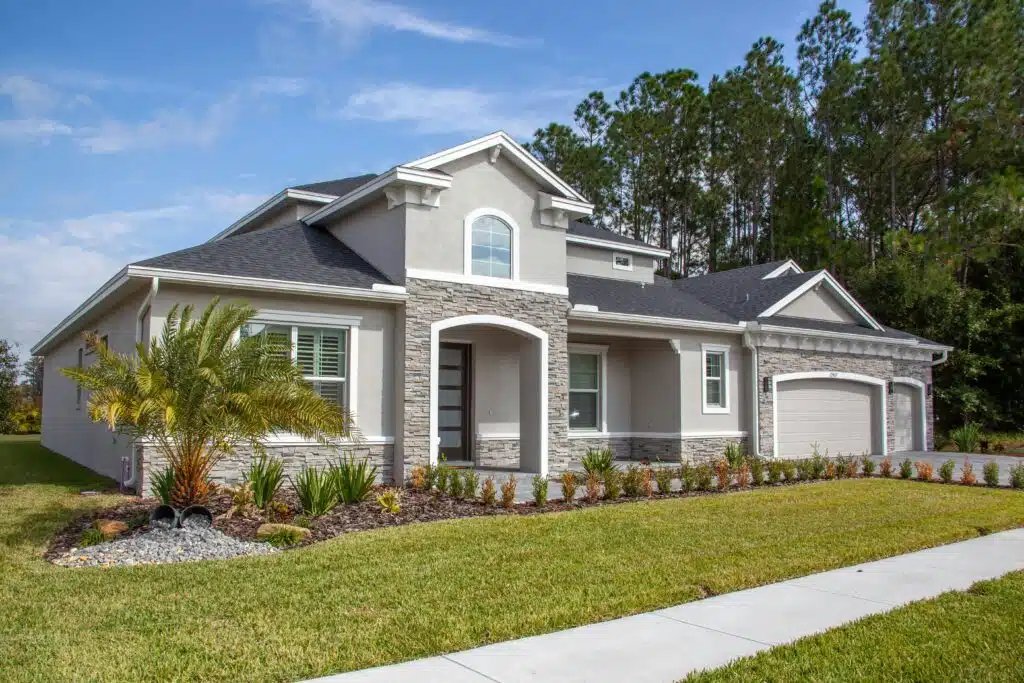 Pest control and property protection for SWFL homes Beautiful modern suburban house in Odessa, FL with lush garden and clear blue sky.