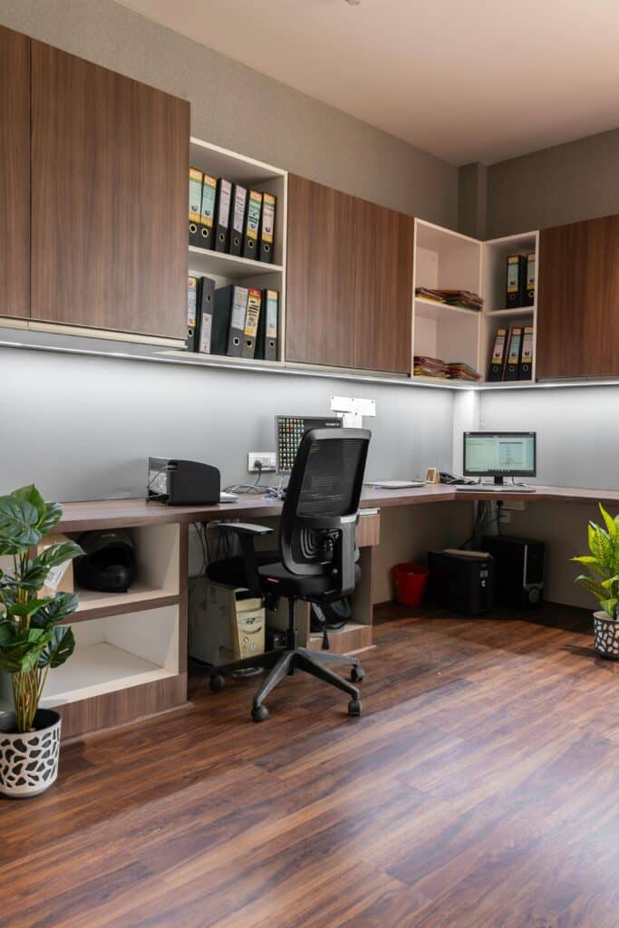 Office Space Stylish office setup featuring wooden cabinetry and modern furnishings. Ideal workspace inspiration.